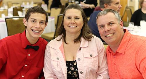 three people smiling